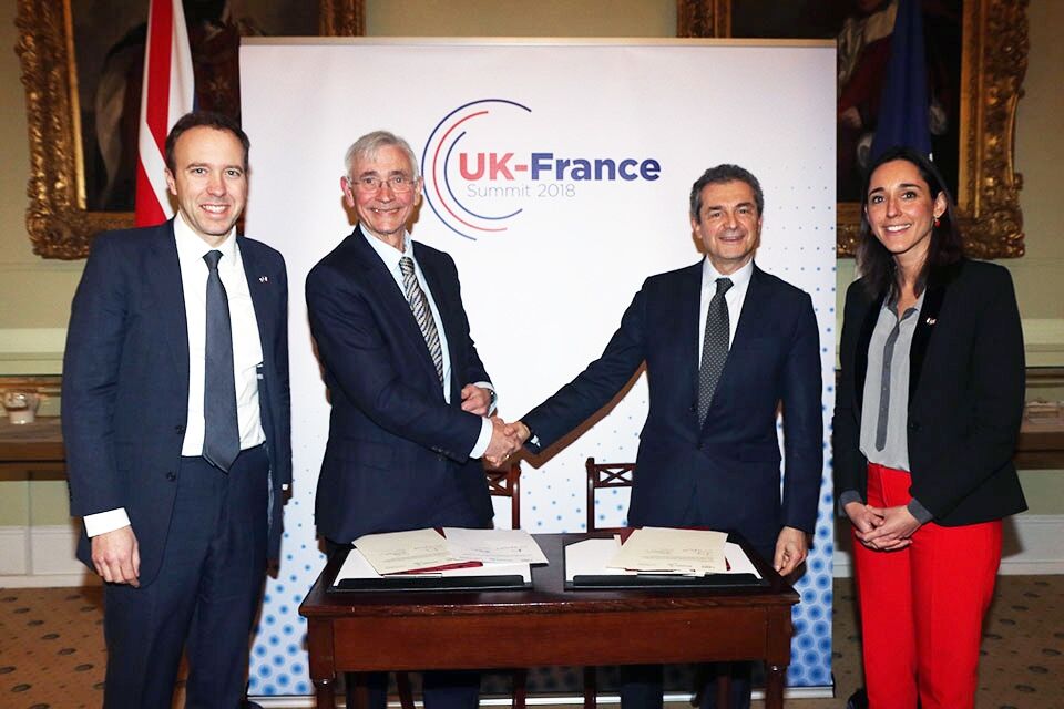 Matt Hancock, John Chisholm, Yves Levy and Brune Poirson facing the camera at the UK-France Summit 2018