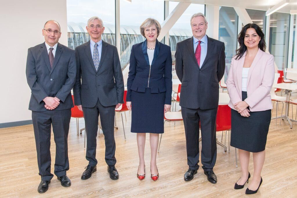Mike Stratton, Sir John Chisholm, Theresa May, David Bentley and Heidi Allen facing camera