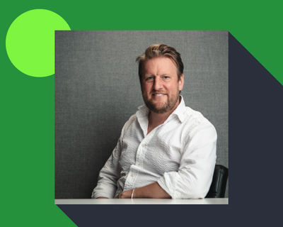 Headshot of Chris Wigley on green background